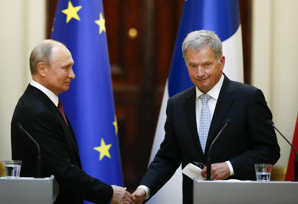 President of the Republic of Finland Sauli Niinisto, right, and Russian President Vladimir Putin shake hands during a news conference at the President's official residence Mantyniemi in Helsinki, Finland, Wednesday, Aug. 21, 2019. (AP Photo/Alexander Zemlianichenko, Pool)