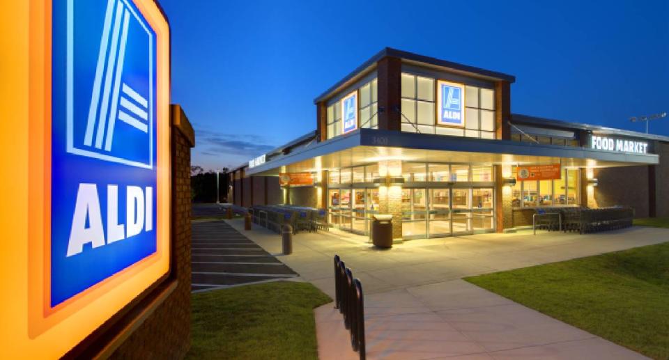 Aldi store sign with Aldi store in background