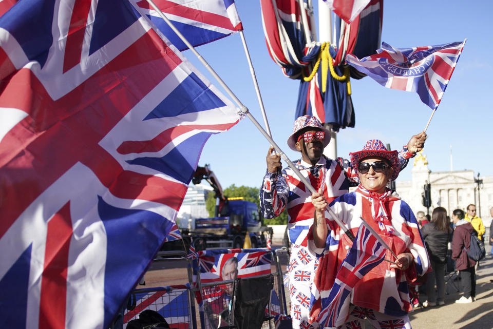 Royal fans on the The Mall wait for the Trooping the Color ceremony at Horse Guards Parade, as King Charles III celebrates his official birthday, London, Saturday, June 15, 2024. (Gareth Fuller/PA via AP)