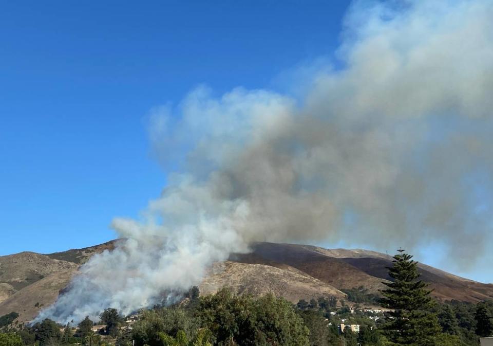 A vegetation fire burns on the hillside near San Luis Obispo High School on Oct. 30, 2023. Evacuations were ordered as the flames moved southeast. San Luis Obispo Fire Department