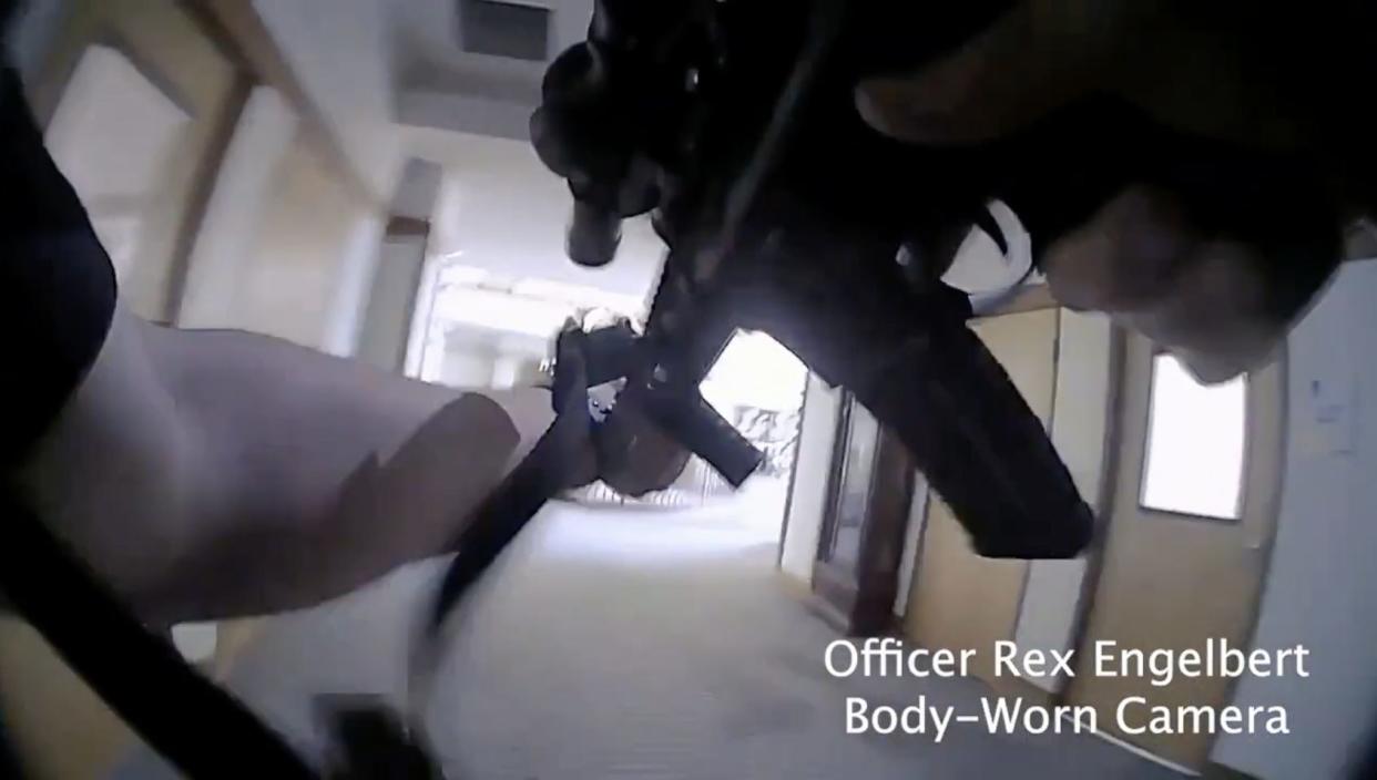 Bodycam footage showing officer holding gun