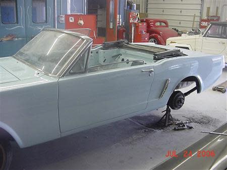 Gail Wise's Skylight Blue 1964 1/2 Ford Mustang convertible is seen with new bodywork during its restoration at a garage in Lake Bluff, Illinois July 24, 2006. Gail Wise, then using her maiden name of Gail Brown, made the first known retail purchase of a Mustang on April 15, 1964, two days before the model went on sale. REUTERS/Courtesy of Tom and Gail Wise/Handout via Reuters