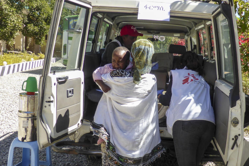 Medecins Sans Frontieres staff transport a patient at a mobile clinic in the town of Hawzen, south of the city of Adigrat, in the Tigray region of northern Ethiopia Wednesday, Jan. 20, 2021. Rare witness accounts are illuminating the shadowy conflict in Tigray, which is largely cut off from the outside world as fighting enters a fourth month in a region of 6 million people. (Konstantina Konstantinidou/Medecins Sans Frontieres via AP)