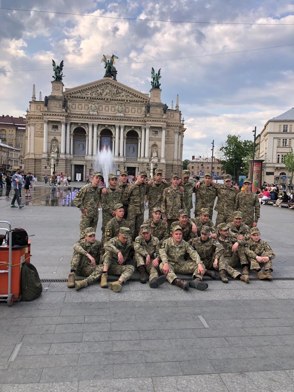 New recruits relax outside the beautiful opera house in Lviv, Ukraine, in September 2023