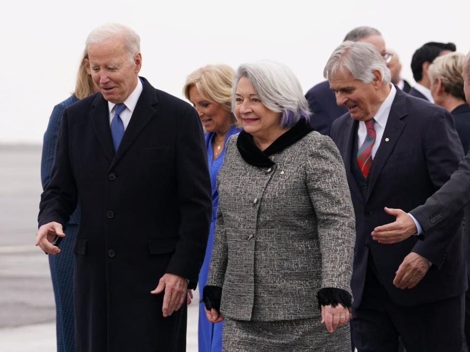 U.S. President Joe Biden is escorted by Gov. Gen. Mary Simon at MacDonald-Cartier International Airport in Ottawa on Thursday, March 23, 2023.  (Kevin Lamarque/Reuters - image credit)