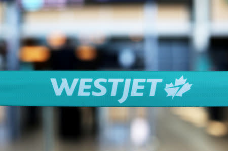 WestJet airline signage is pictured at Vancouver's international airport in Richmond, British Columbia, Canada, February 5, 2019. REUTERS/Ben Nelms