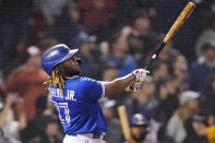 Toronto Blue Jays designated hitter Vladimir Guerrero Jr. watches his solo home run, tying the game at 1-1, in the top of the ninth inning of a baseball game against the Boston Red Sox at Fenway Park, Monday, June 14, 2021, in Boston. (AP Photo/Charles Krupa)