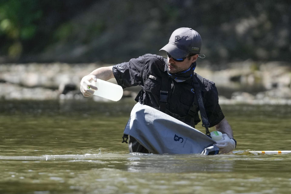 Ryan Lehman, a researcher for the University of Southern Mississippi, takes water samples and measures water chemistry and velocity to test for environmental DNA, in the Strong River, a tributary of the Pearl River, in Pinola, Miss., Monday, July 31, 2023. Biologists from the U.S. Fish and Wildlife, the Mississippi Department of Wildlife Fisheries and Parks, the University of Southern Mississippi, and the Garden Club of Jackson, released a brood of threatened pearl darter fish, which haven't lived in the Pearl River system for 50 years. (AP Photo/Gerald Herbert)