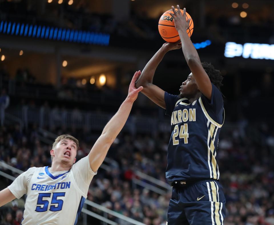 Akron's Ali Ali (24) is fouled by Creighton's Baylor Scheierman (55) as he shoots during the first half of the Zips' NCAA Tournament first-round game at PPG Paints Arena on Thursday in Pittsburgh.