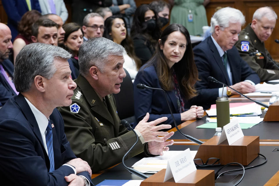 National Security Agency Director Gen. Paul Nakasone, second from left, testifies on Capitol Hill in Washington, Tuesday, March 8, 2022, during a House Permanent Select Committee on Intelligence hearing on worldwide threats. Joining him at the witness table is, from left, FBI Director Christopher Wray, Director of National Intelligence Avril Haines, Central Intelligence Agency Director William Burns, and Defense Intelligence Agency Director Lt. Gen. Scott Berrier. (AP Photo/Susan Walsh)