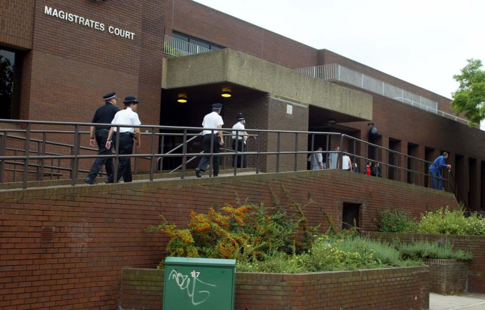 Police wait outside Peterborough Magistrates Court where Maxine Carr will attend court via video link from Holloway Prison, on charges of perverting the course of justice in connection with the murders of the ten year old girls Holly Wells and Jessica Chapman.   (Photo by Andrew Parsons - PA Images/PA Images via Getty Images)