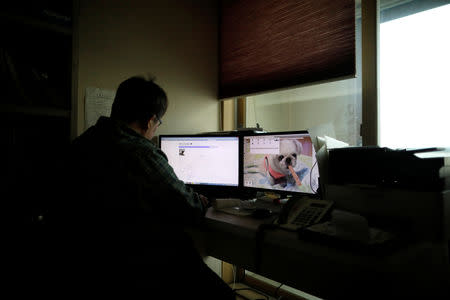 Lee Jae-hwan's pet dog Kkotgae is seen on his computer screen at his home in Namyangju, South Korea, January 10, 2019. REUTERS/Kim Hong-Ji