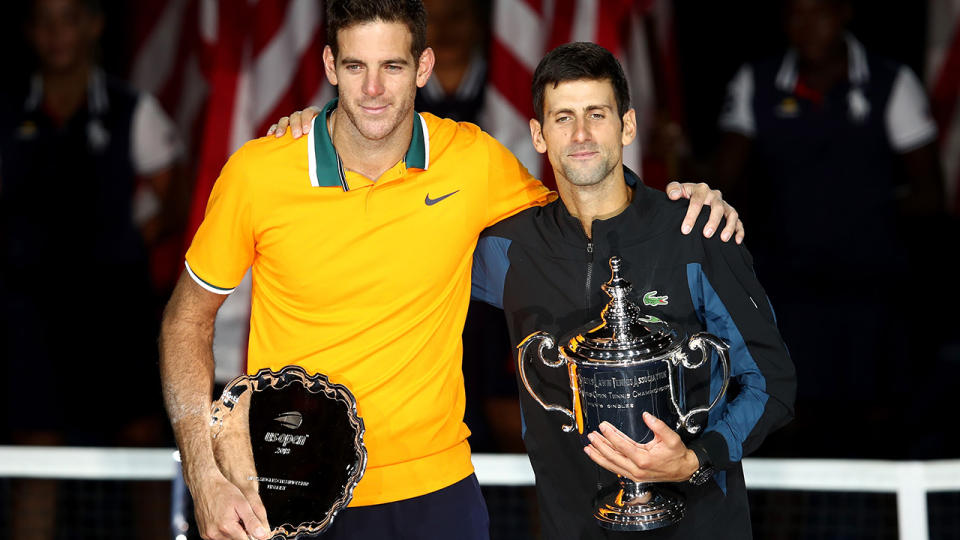 Novak Djokovic poses with Juan Martin del Potro after winning his men’s Singles finals match. (Photo by Julian Finney/Getty Images)