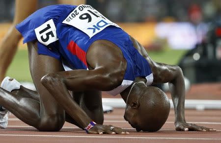 Mo Farah of Britain reacts afterw winning the men's 5000m event during the 15th IAAF World Championships at the National Stadium in Beijing, China August 29, 2015. REUTERS/Lucy Nicholson TPX IMAGES OF THE DAY