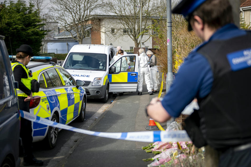 FILE PICTURE - Police, forensic officers and floral tributes at the Bradley Lewis stabbing scene in Chipperfield Drive, Kingswood, Bristol.  March 27, 2022. An OnlyFans model has admitted stabbing a father-of-four to death on the outskirts of Bristol.  See SWNS story SWBRtrial.  Bradley Lewis died after being knifed in the chest at the pair's home in Chipperfield Drive, Kingswood, at around 8.20pm on Friday, March 25 this year.  Appearing at Bristol Crown Court today (July 7), 24-year-old Abigail White pleaded guilty to a charge of manslaughter - but denies murder.  Adam Vaitilngam QC, prosecuting, confirmed the matter must proceed to trial on the murder charge.  A trial was set down for October 10. White was remanded in custody. 