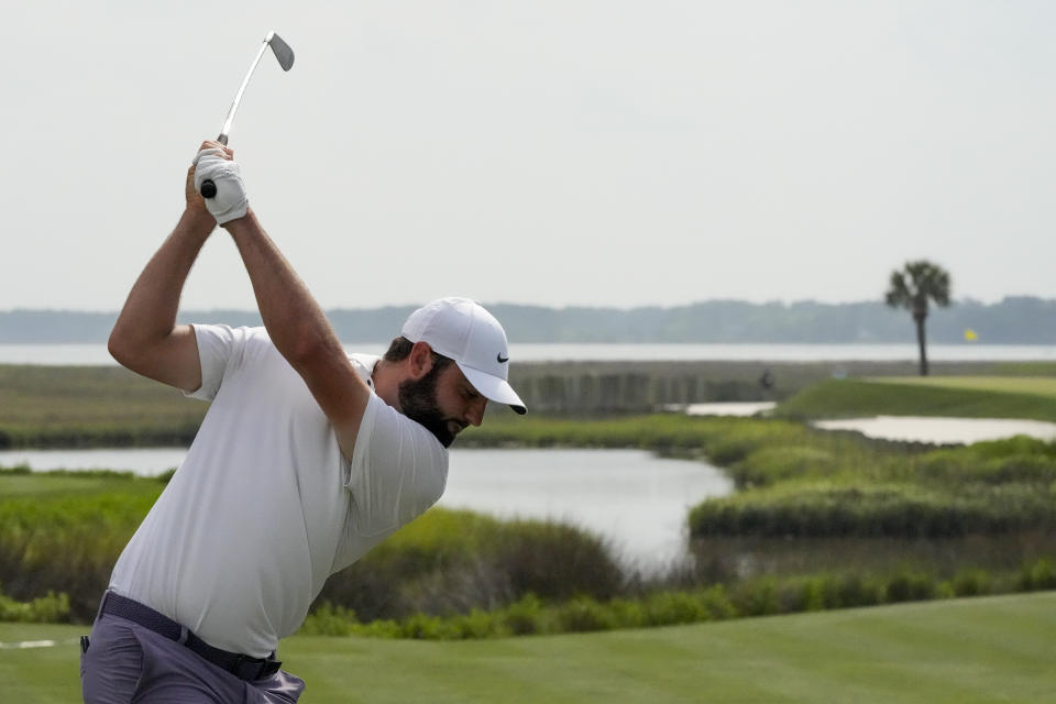 Scottie Scheffler hits his tee shot on the 17th hole during the third round of the RBC Heritage golf tournament, Saturday, April 20, 2024, in Hilton Head Island, S.C. (AP Photo/Chris Carlson)