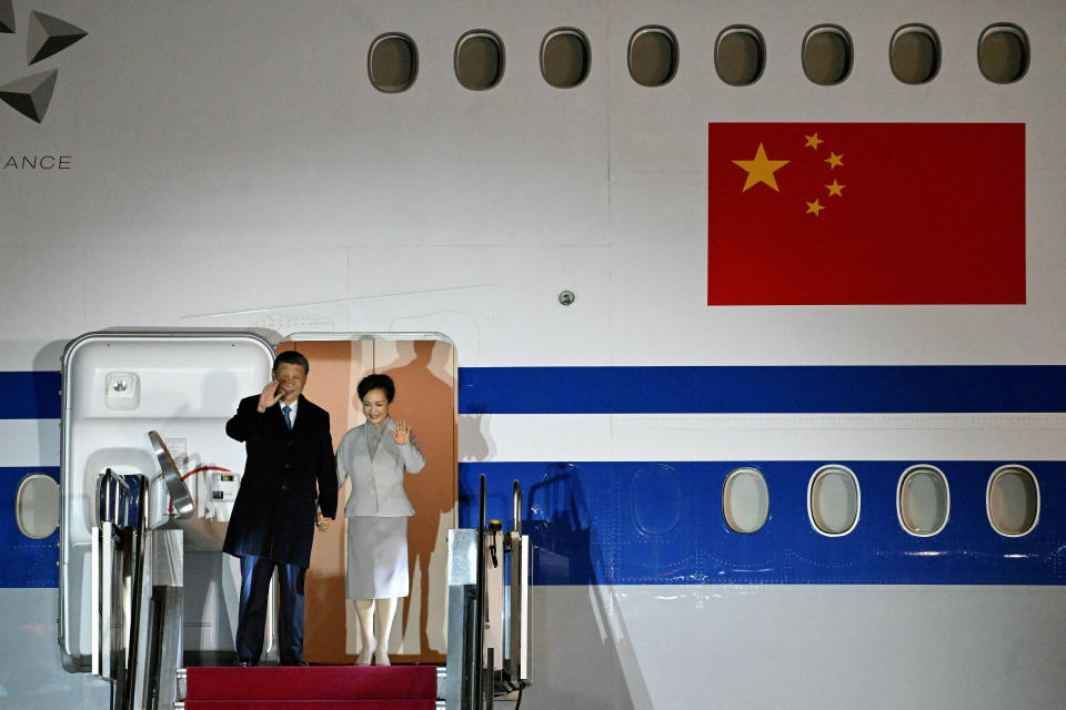 Chinese President Xi Jinping and his wife Peng Liyuan wave as they arrive at Liszt Ferenc Budapest airport at Ferihegy, Hungary on May 8, 2024. The Chinese President pays a three day official visit to Budapest from the evening of May 8, 2024. (Photo by Szilard KOSZTICSAK / POOL / AFP) (Photo by SZILARD KOSZTICSAK/POOL/AFP via Getty Images)