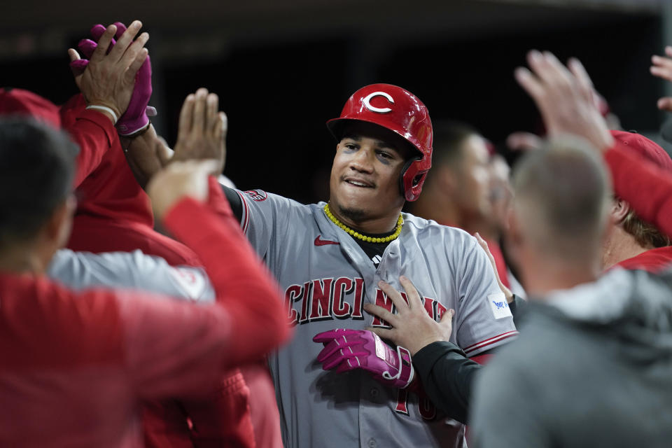 Cincinnati Reds' Noelvi Marte celebrates scoring against the Detroit Tigers in the 10th inning of a baseball game, Tuesday, Sept. 12, 2023, in Detroit. (AP Photo/Paul Sancya)