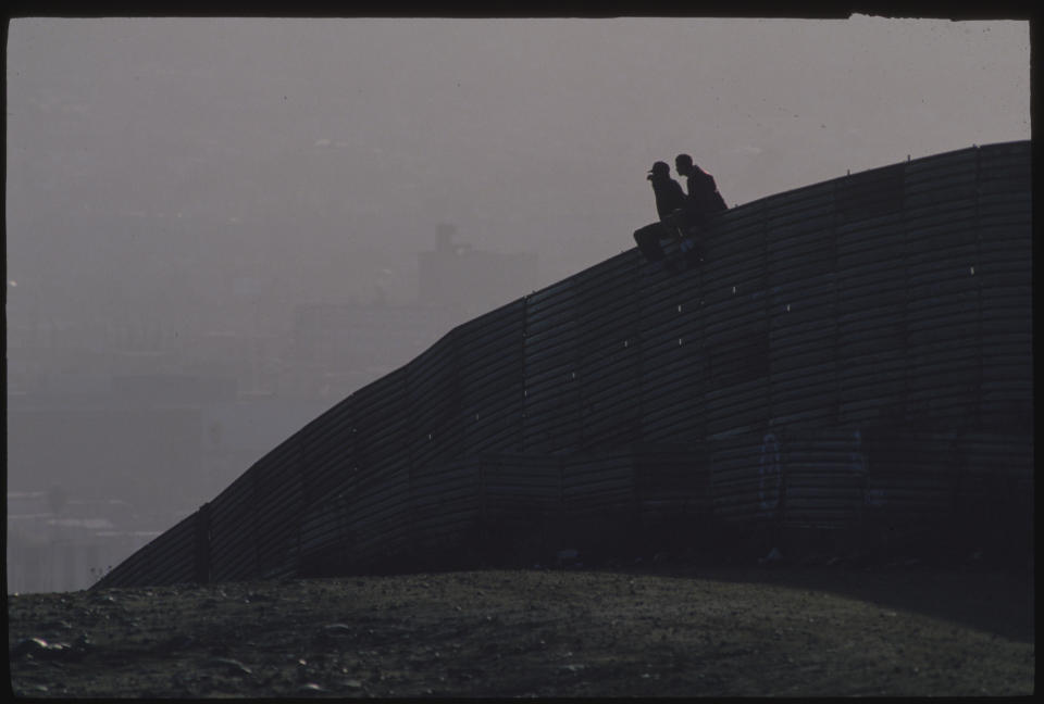 At first light, undocumented immigrants&nbsp;wait to cross over into the United States.