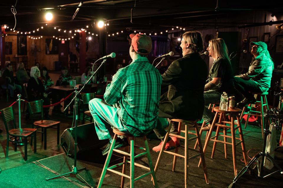 WORCESTER - “Shot of Poison” band members take questions on stage during a watch party at Rascals.