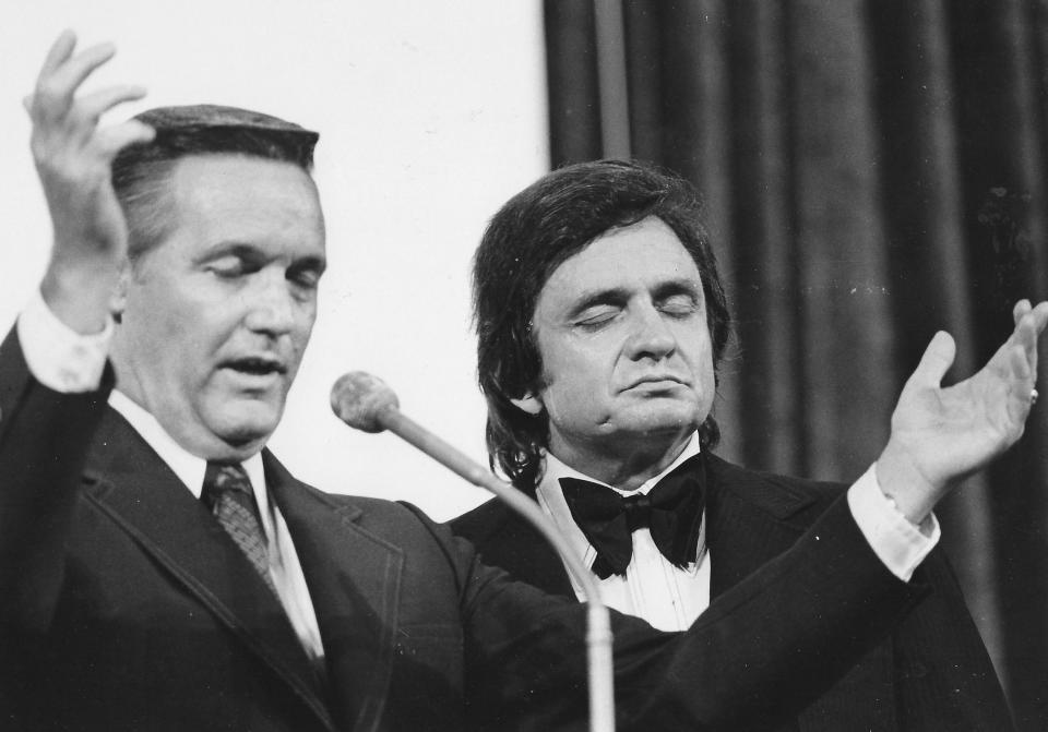 The Rev. Rex Humbard prays with country star Johnny Cash at the Cathedral of Tomorrow in August 1973.