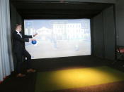This April 30, 2019 photo shows Mike Donovan, chief marketing officer for the Ocean Casino Resort, playing a game of virtual dodge ball at a sports simulator at the Atlantic City N.J. casino. The casino formerly known as Revel will turn a profit in May after months of steep losses. (AP Photo/Wayne Parry)