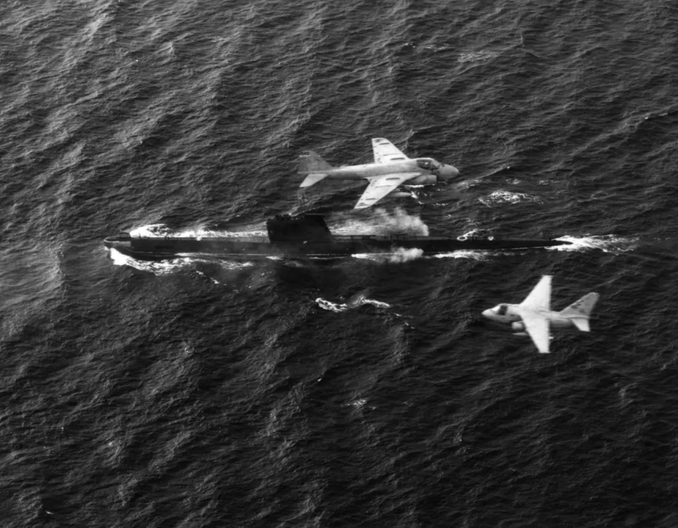 An S-3 Viking and A-6 Intruder from the USS <em>John F. Kennedy</em> (CV-67) fly over a Soviet <em>Foxtrot</em> class diesel submarine. <em>U. S. Navy</em>
