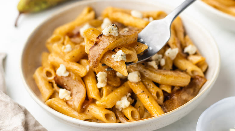 Pear and gorgonzola pasta bite on fork