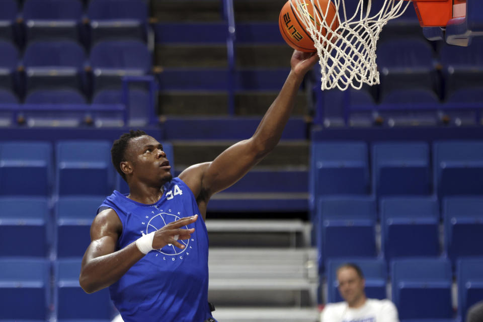 Kentucky's Oscar Tshiebwe shoots during an NCAA college basketball open house practice in Lexington, Ky., Monday, Oct. 11, 2021. (AP Photo/James Crisp)