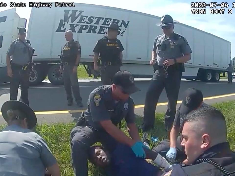 Body camera footage shows authorities rendering aid to Jadarrius Rose after he was attacked by a police dog.