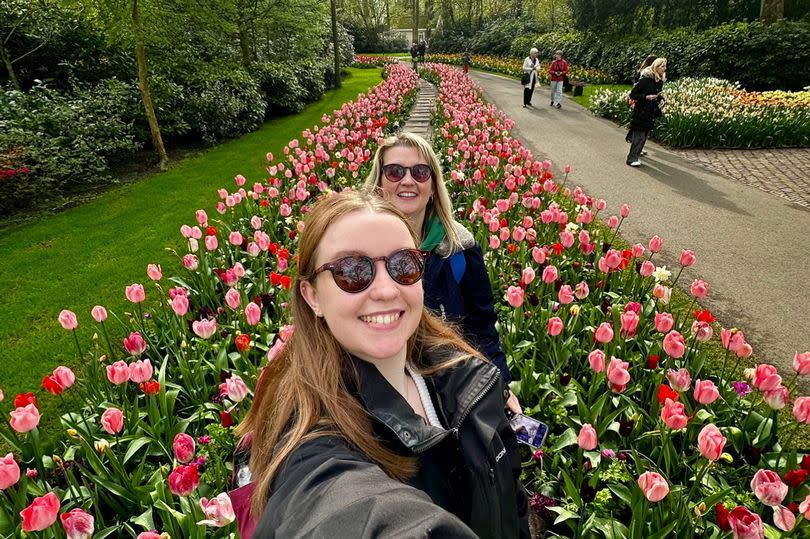 Ellie and her mum Coral with the tulips in Amsterdam on their trip in February 2024. -Credit:SWNS