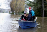 <p>Mina Tayarani is evacuated from her home in a flooded residential neighbourhood in Ile Bizard, Quebec, Canada May 8, 2017. (Christinne Muschi/Reuters) </p>