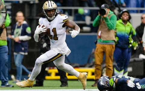 New Orleans Saints running back Alvin Kamara (41) runs the ball in for a touchdown against the Seattle Seahawks during the first half at CenturyLink Field - Credit: USA Today