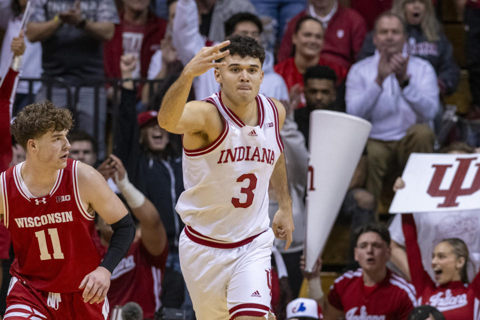 Indiana guard Anthony Leal (3) reacts after scoring a 3-point basket during the first half of an NCAA college basketball game against Wisconsin, Tuesday, Feb. 27, 2024, in Bloomington, Ind. (AP Photo/Doug McSchooler)