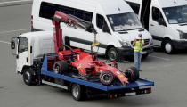 The car of Ferrari driver Sebastian Vettel of Germany sits on a flatbed truck after a crash during the qualifying session for the upcoming Russian Formula One Grand Prix, at the Sochi Autodrom circuit, in Sochi, Russia, Saturday, Sept. 26, 2020. The Russian Formula One Grand Prix will take place on Sunday. (AP Photo/Pavel Golovkin, Pool)