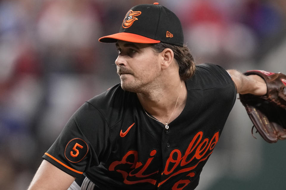 Baltimore Orioles starting pitcher Dean Kremer (64) wears a Star of David necklace as he pitches in the first inning of Game 3 of a baseball AL Division Series against the Texas Rangers on Tuesday, Oct. 10, 2023, in Arlington, Texas. (AP Photo/Tony Gutierrez )