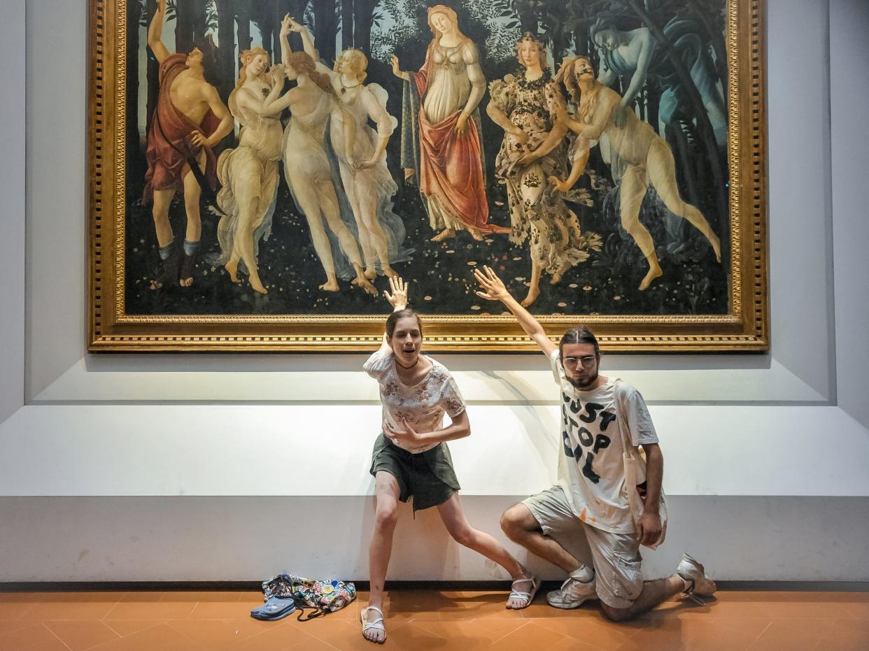 Protestors from the action group Ultima Generazione glue their hands to the glass covering Sandro Botticelli's La Primavera at Uffizi on July 22, 2022 in Florence, Italy.