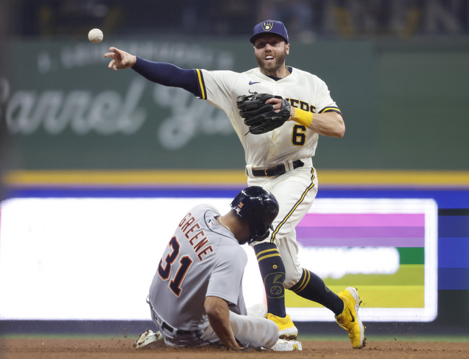 Milwaukee Brewers second baseman Owen Miller (6) forces out Detroit Tigers' Riley Greene (31) at second base and completes a double play during the fifth inning of a baseball game Monday, April 24, 2023, in Milwaukee. (AP Photo/Jeffrey Phelps)