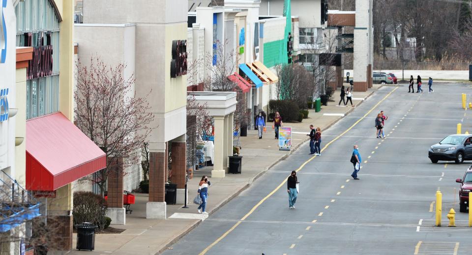 Shoppers visit stores on March 25, 2021, in the Millcreek Pavilion area of the Millcreek Mall complex in Millcreek Township.