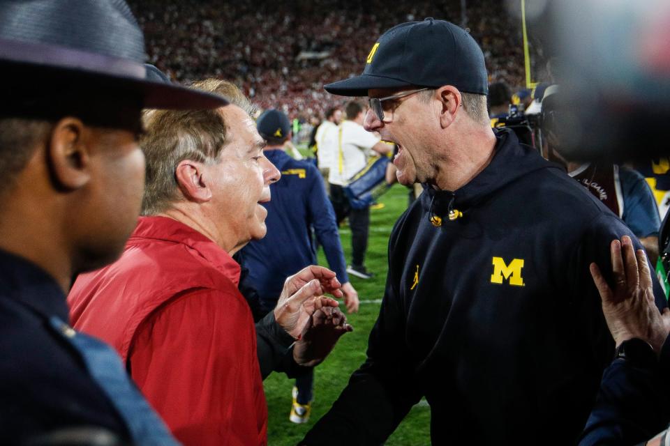 Michigan coach Jim Harbaugh shakes hands with Alabama coach Nick Saban after U-M's 27-20 overtime win over Alabama at Rose Bowl Stadium in Pasadena, California, on Monday, Jan. 1, 2024.