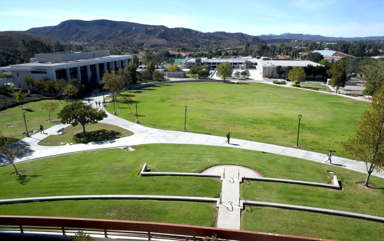 This 2022 file photo shows students walking through a grassy area at Moorpark College where an amphitheater project is proposed to be built. A fundraising event June 29 will feature a performance by rock singer Pat Benatar.