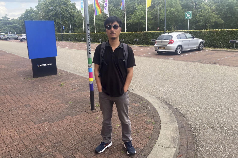 In this photo released by Gao Zhi, the Chinese dissident poses for a photo in the Hilversum district near Amsterdam, Netherlands, on July 19, 2023. Gao's wife and daughter are in detention on immigration charges in Thailand, after a series of bomb threats made in their names against airports, luxury hotels and the Chinese embassy in Bangkok derailed the family’s plan to join him in the Netherlands. (Gao Zhi via AP)