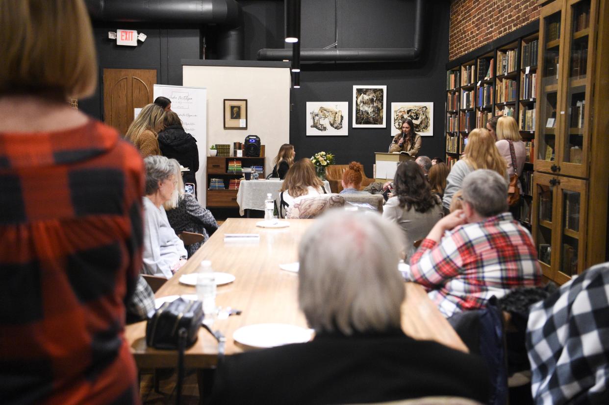 Voice actor Amanda Stribling reads a portion of Audra McElyea’s new book at her book launch at Addison’s Bookstore on Gay Street, Friday, Jan. 5, 2024.