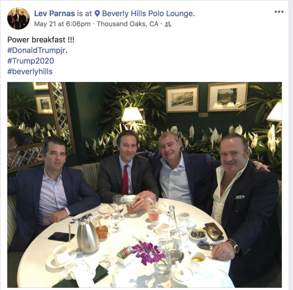 This Facebook screen shot provided by The Campaign Legal Center, shows from left, Donald Trump, Jr., Tommy Hicks, Jr., Lev Parnas and Igor Fruman, posted on May 21, 2018. (The Campaign Legal Center via AP)