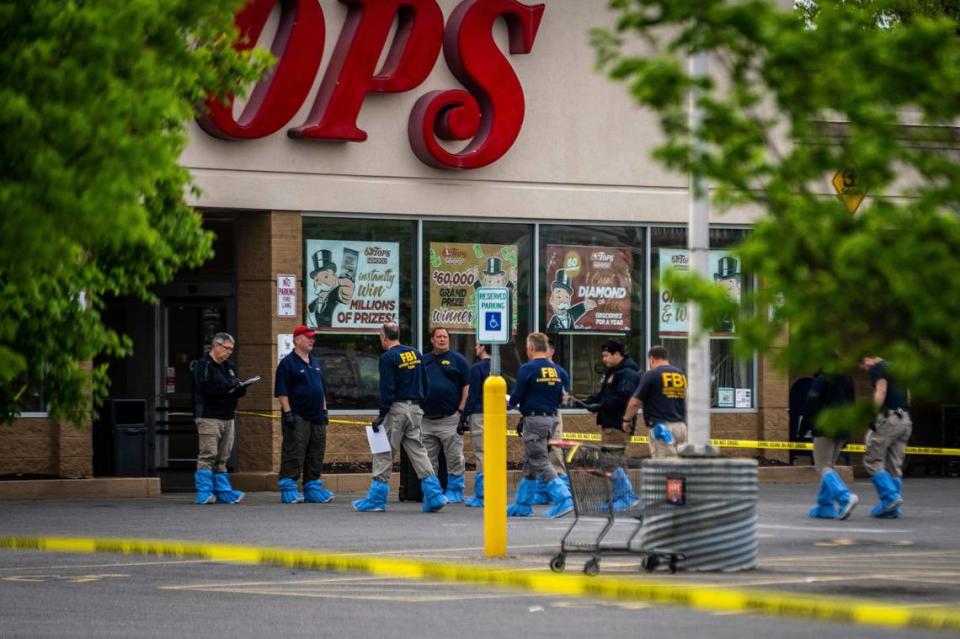 FBI Investigators enter the Tops supermarket in Buffalo, N.Y. on Monday, May 16 2022. (AP Photo/Robert Bumsted)