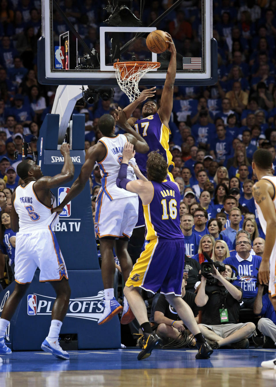 OKLAHOMA CITY, OK - MAY 14: Andrew Bynum #17 of the Los Angeles Lakers slam dunks in front of Serge Ibaka #9 of the Oklahoma City Thunder in Game One of the Western Conference Semifinals in the 2012 NBA Playoffs on May 14, 2012 at the Chesapeake Energy Arena in Oklahoma City, Oklahoma. NOTE TO USER: User expressly acknowledges and agrees that, by downloading and or using the photograph, User is consenting to the terms and conditions of the Getty Images License Agreement. (Photo by Brett Deering/Getty Images)