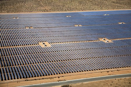 FILE PHOTO: An array of solar panels is seen in the desert near Victorville