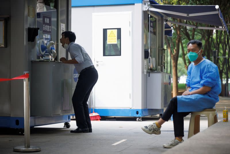 A man gets a swab at a nucleic acid testing booth following a coronavirus disease (COVID-19) outbreak in Beijing