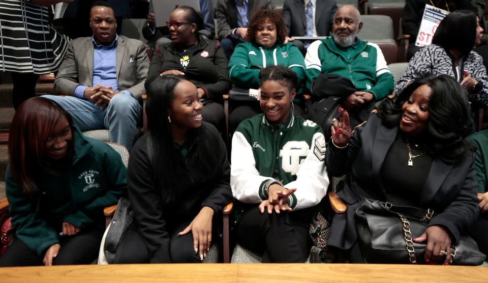 From left, Kennedy Watts, Nyla Joseph and Sydney Evans, all members of the Detroit Cass Tech High School girls golf team talk with their school principal Lisa Phillips before the Detroit City Council meeting at the Coleman A. Young Municipal Center in downtown Detroit on Tuesday, November 7, 2023.