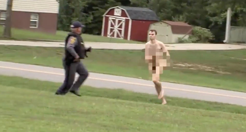 A teenager caught in a bizarre video running naked from police, is a suspect in the murder of three people in the US state of Virginia. Source: ABC News 13